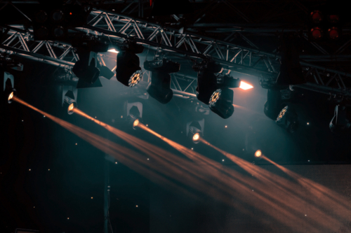 luminous-rays-from-concert-lighting-against-a-dark-YN2CL79